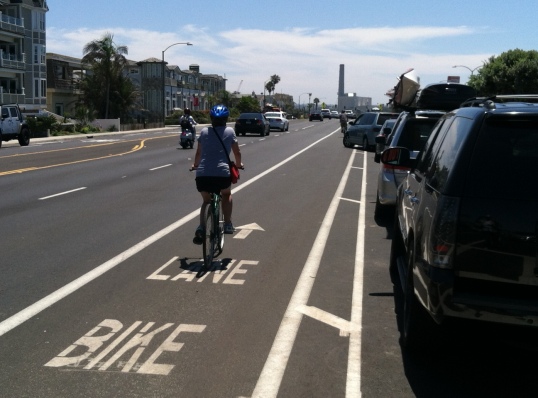 The southbound side of the coast highway in Carlsbad now has a buffer protecting cyclists from the "door zone" as they pass parked cars. 
