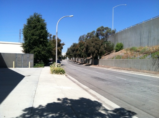 Typical border vacuum, Pasadena, CA. Car-dependent shopping center on left, freeway on right create unsafe space devoid of all social life, except, perhaps crime. 